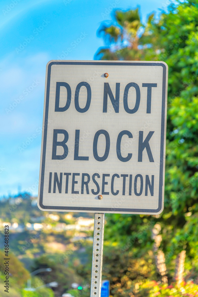 Close-up on a road sign with do not block intersection at La Jolla, San Diego, California
