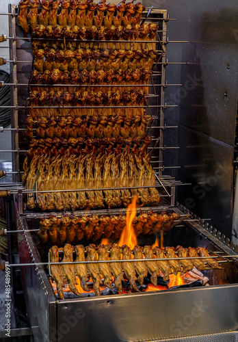 Photography Large chicken wings flame grilled at a hawker stall in Singapore