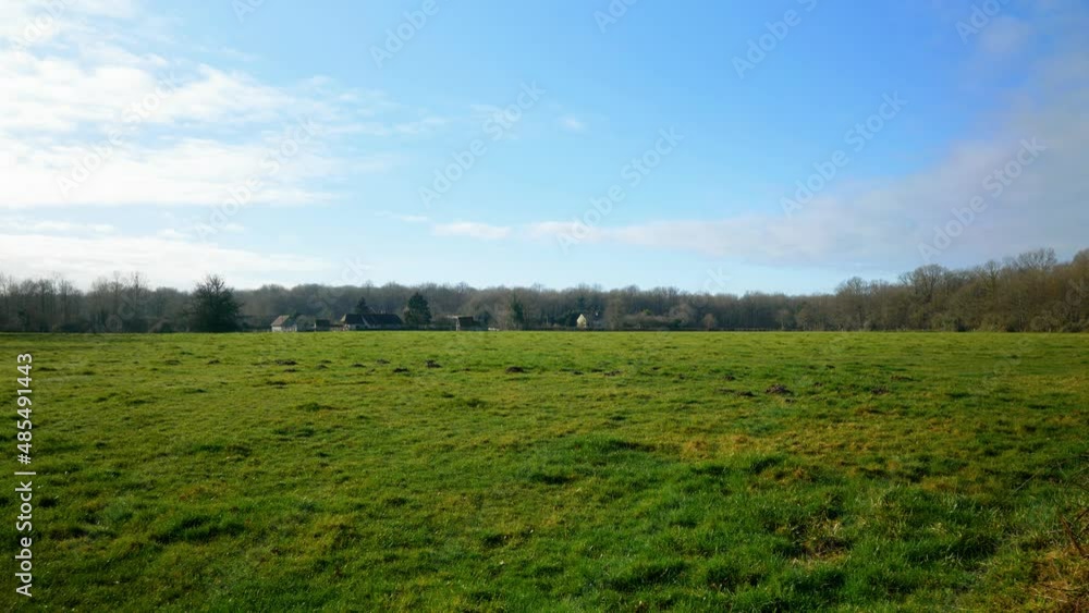 4K Cinematic landscape nature shot of a field on a sunny day in the French countryside of Normandy. 4K Cinematic landscape nature shot of a field on a sunny day in the French countryside of Normandy.