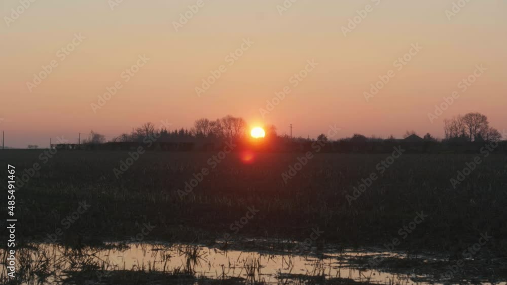 4K Cinematic landscape still shot of a field during sunset in the French countryside. 4K Cinematic landscape still shot of a field during sunset in the French countryside.