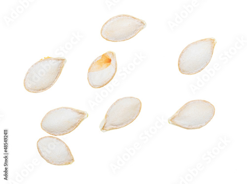 Close-up of pumpkin seeds on a white background. Macro