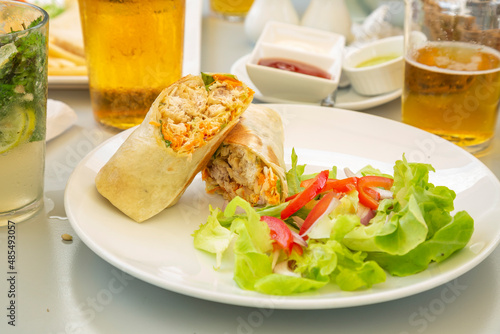 salad ,chicken and vegetables wrap.
