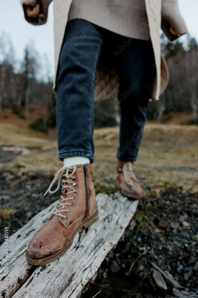 women's autumn shoes wooden board stream close-up women's autumn shoes wooden board stream close-up