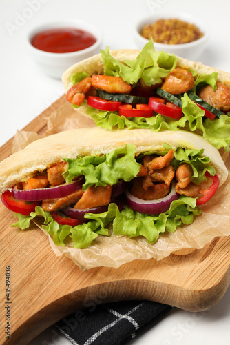 Concept of tasty food with pitas with chicken, close up