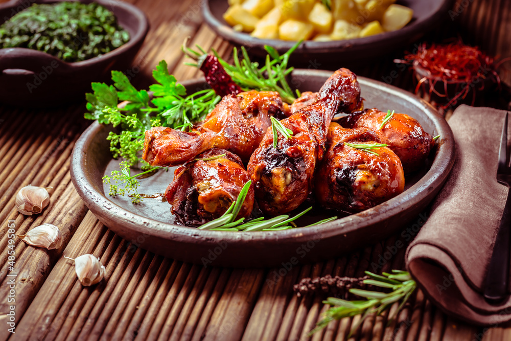 Marinated chicken drumsticks with baked potatoes and spinach Marinated chicken drumsticks with baked potatoes and spinach