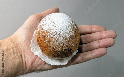 Lithuanian donut on a napkin in the palm of your hand