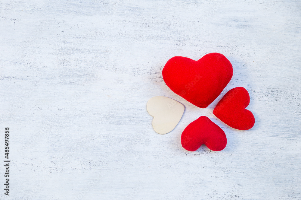 Red heart arrange on white table background, love and romance symbol, valentine card concept background Red heart arrange on white table background, love and romance symbol, valentine card concept background