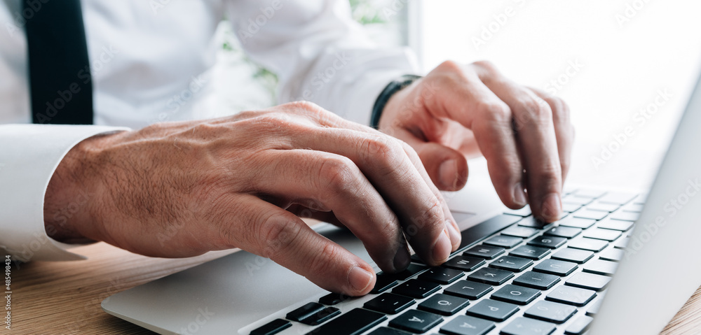 Technical writer typing laptop keyboard, closeup of hands Technical writer typing laptop keyboard, closeup of hands