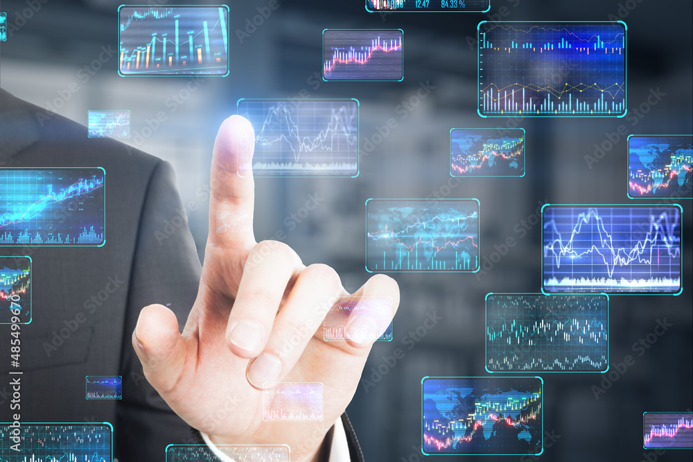 Close up of businessman finger pointing at various forex screens on blurry background. Cryptocurrency, bticoin trading and finance concept. Double exposure.