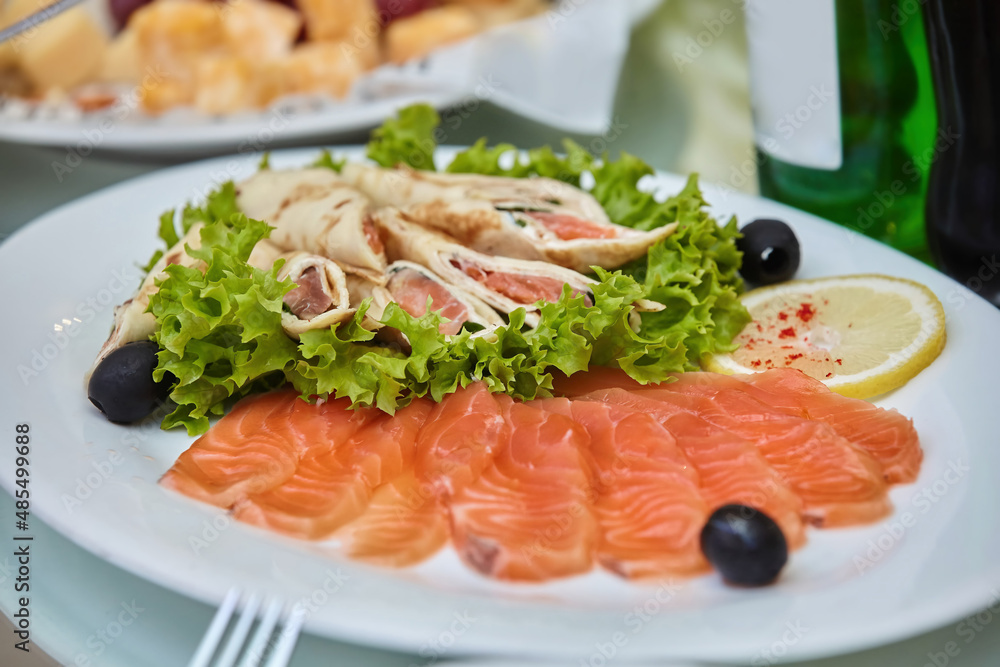 The food in the restaurant fish dish cutting of different types of fish and seafood on a platter