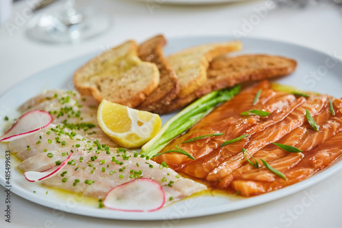 The food in the restaurant fish dish cutting of different types of fish and seafood on a platter