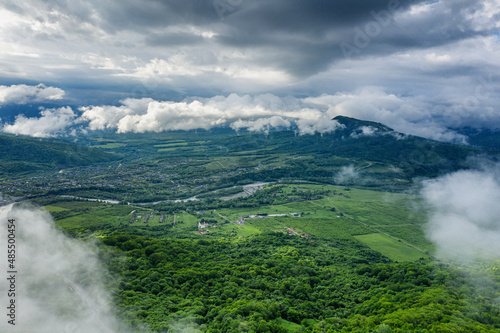 The Caucasus Mountains. Adygeya. The valley of the Belaya River. Low cloud cover. Aerial view.