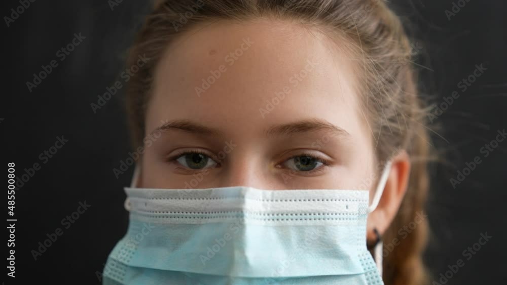 Girl in protective mask. Child face in safety mask. Prevention of diseases by virus. Portrait of girl in protective mask. Schoolgirl in medical mask. Close-up of child face. Fighting virus at school Girl in protective mask. Child face in safety mask. Prevention of diseases by virus. Portrait of girl in protective mask. Schoolgirl in medical mask. Close-up of child face. Fighting virus at school