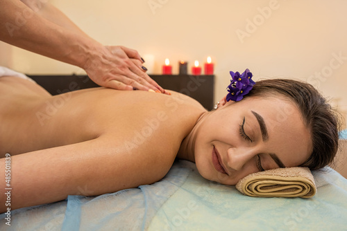Deep massage of all muscle tissues and joints of a young attractive woman.
