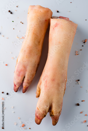 Pork hoof feet on white background. Close-up