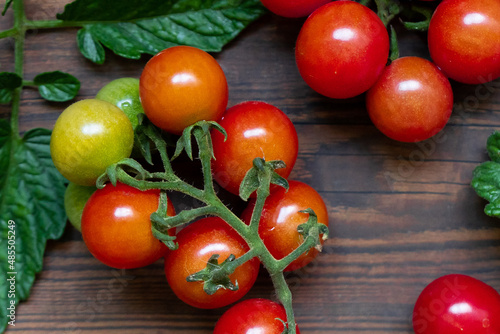 cherry tomatoes on wooden table background
