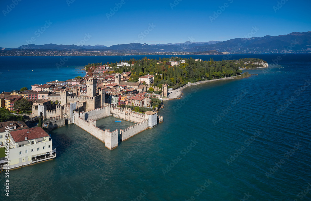 Sirmione aerial view. Top view, historic center of the Sirmione peninsula, lake garda. Lake Garda, Sirmione, Italy. Aerial panorama of Sirmione. Autumn in Sirmione.