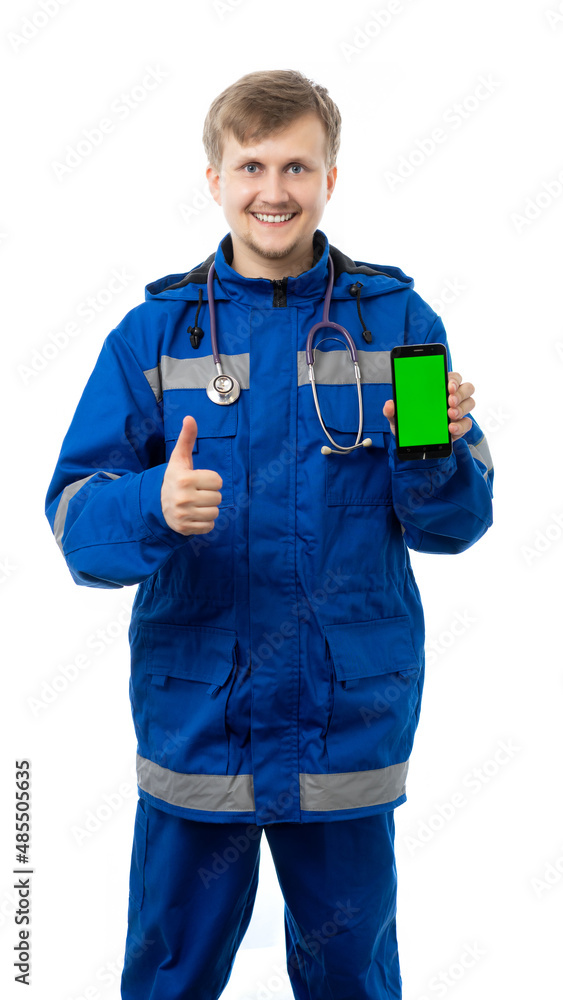 a man in a blue jacket and trousers holds the phone and shows the class, the lifeguard smiles and looks at us. place for an inscription. isolated, white background a man in a blue jacket and trousers holds the phone and shows the class, the lifeguard smiles and looks at us. place for an inscription. isolated, white background