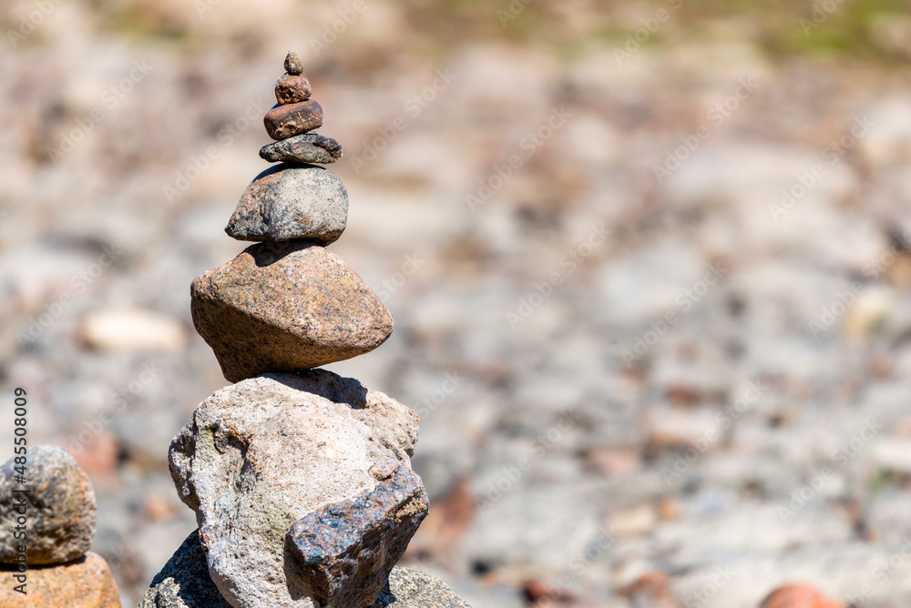 Sea pebbles or stones tower on a beach