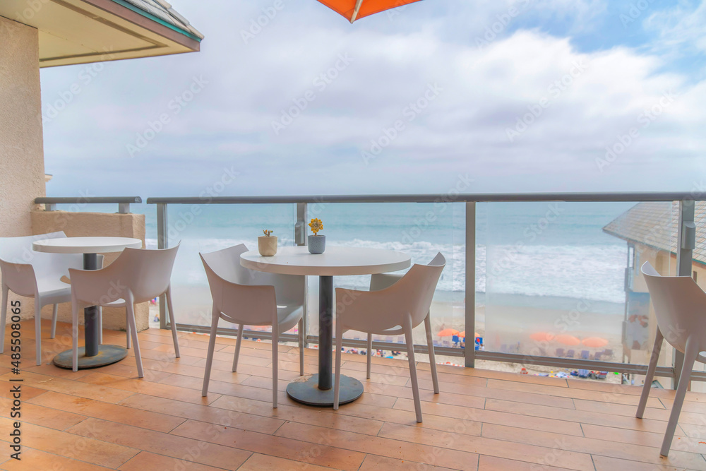 Dining tables at the deck with a view of the ocean at Carlsbad, San Diego, California
