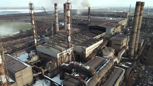 ironworks factory top view drone flight smoke from chimneys photo