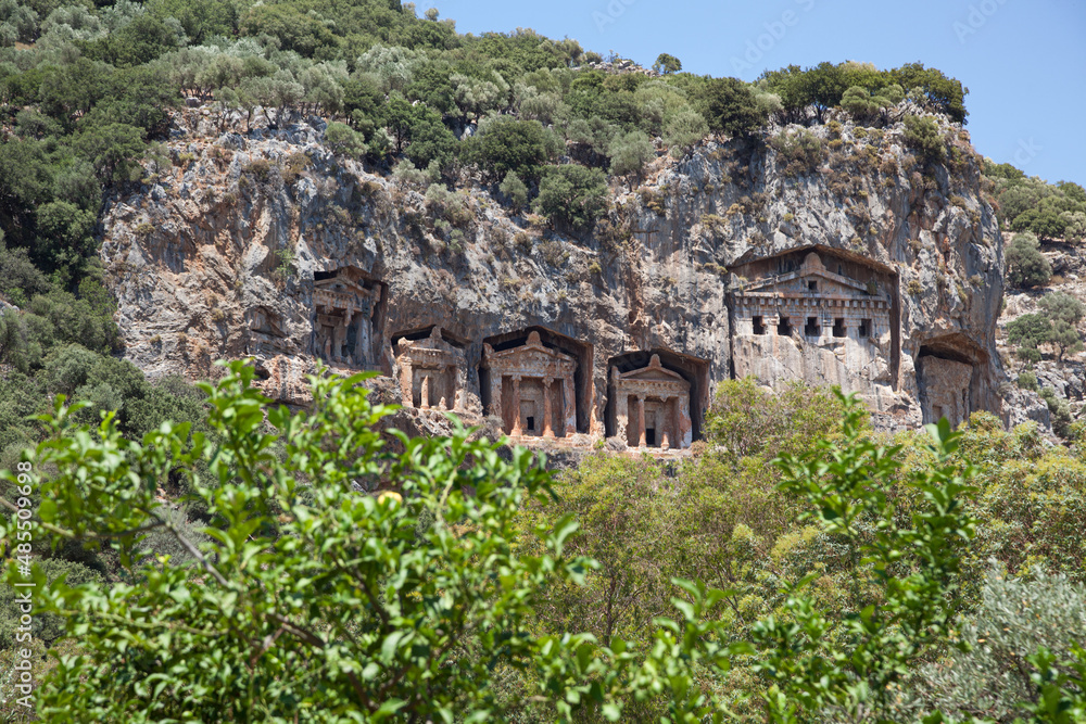 Koycegiz, Mugla, Turkey - July 12 2017: The rock tombs of the kings in the ancient city of Kaunos in Koycegiz Dalyan