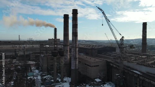 ironworks factory top view drone flight smoke from chimneys photo