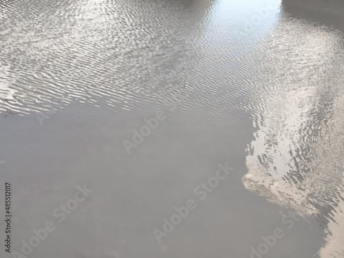 blurry reflection of houses in the water