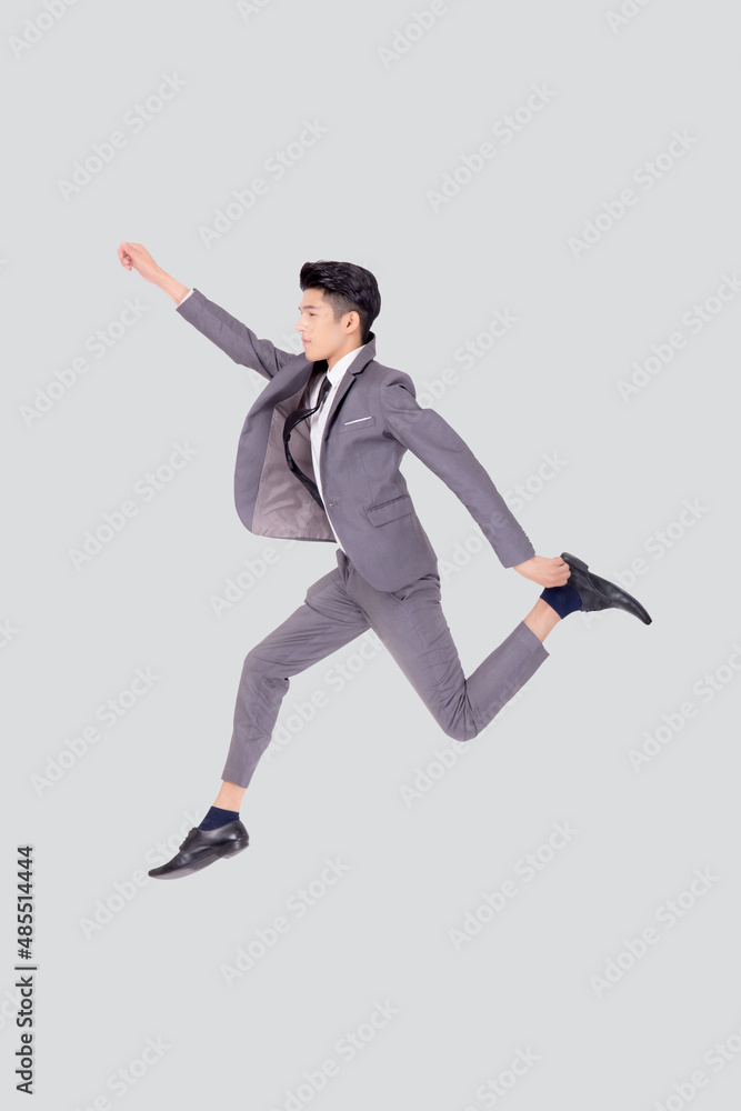 Young asian business man in suit jumping isolated on white background, full length, happy handsome businessman jump and flying success and excited, male confident, manager or executive with win.