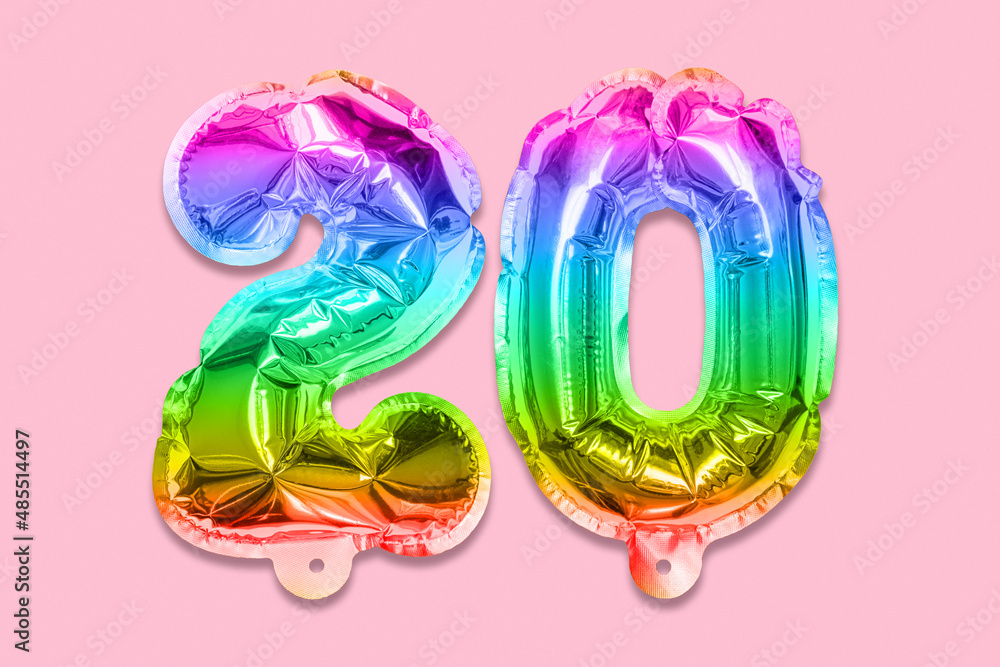 Rainbow foil balloon number, digit twenty on a pink background. Birthday greeting card with inscription 20. Anniversary concept. Top view. Numerical digit. Celebration event, template. Rainbow foil balloon number, digit twenty on a pink background. Birthday greeting card with inscription 20. Anniversary concept. Top view. Numerical digit. Celebration event, template.