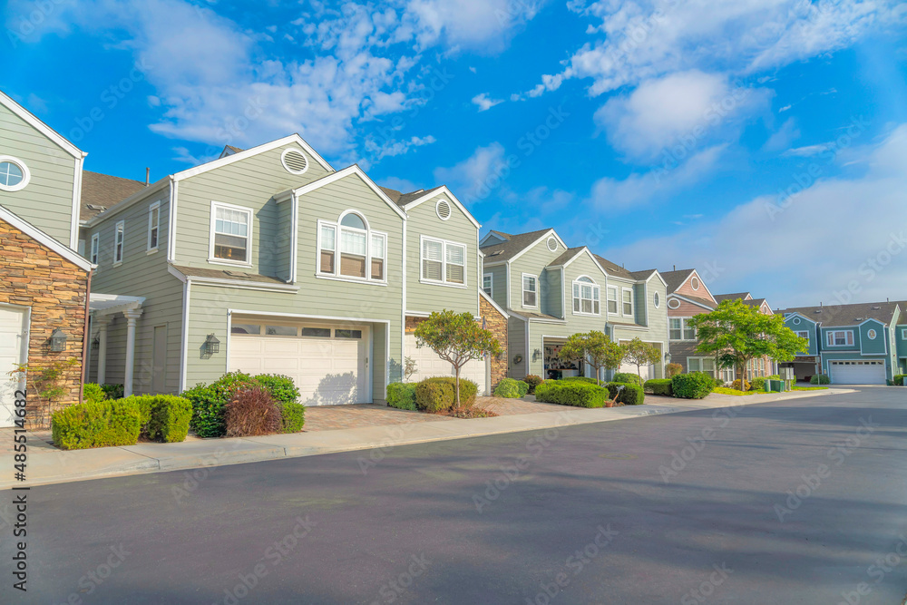 Duplex houses with green wood vinyl sidings at Carlsbad, San Diego, California Duplex houses with green wood vinyl sidings at Carlsbad, San Diego, California