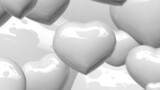 zoom on various size of white shinny hearts in landscape format