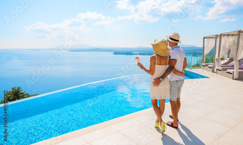 Wealthy couple enjoying beautiful sea view of luxury Mediterranean villa © Kaspars Grinvalds