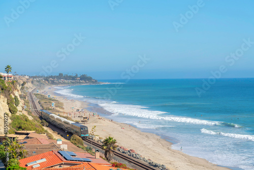 Train passing near the beach at San Clemente, California photo