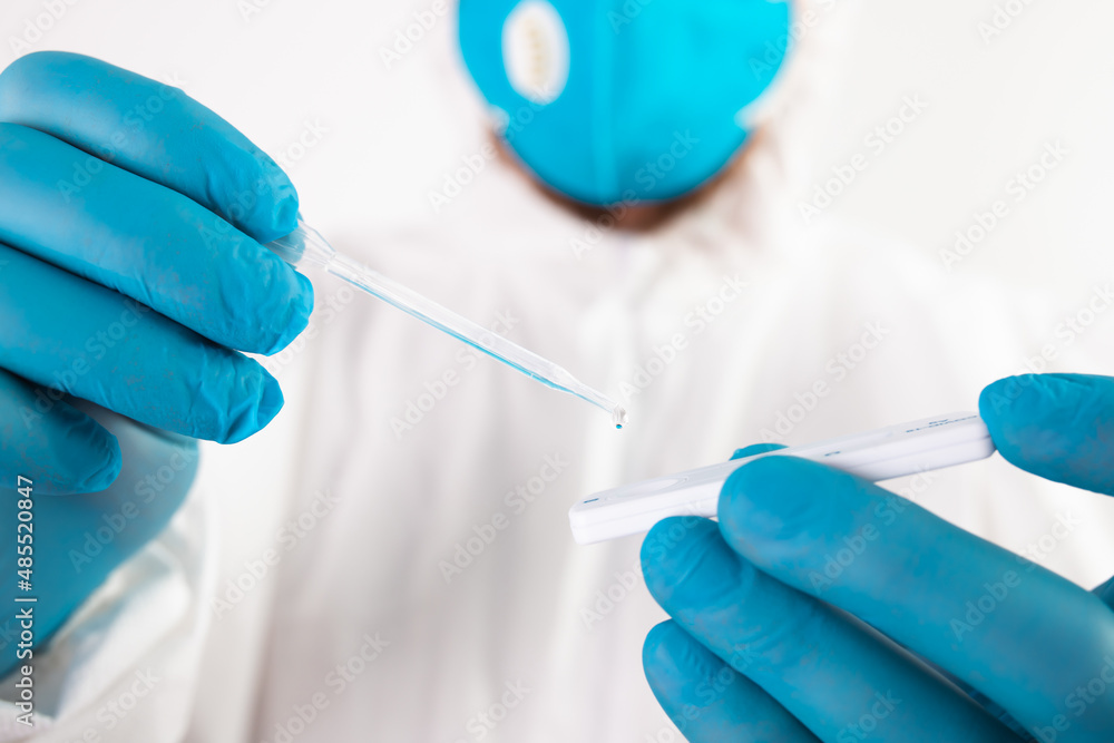 Doctor with laboratory COVID-19 test kit for diagnosis coronavirus infection. Doctor with laboratory COVID-19 test kit for diagnosis coronavirus infection.