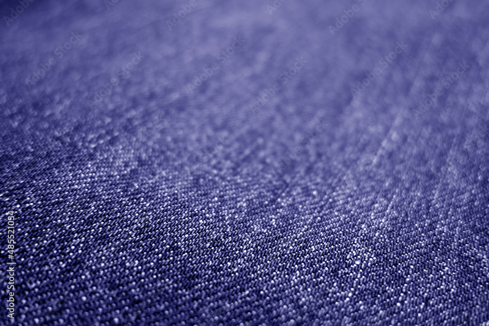 Jeans cloth pattern with blur effect in blue tone.