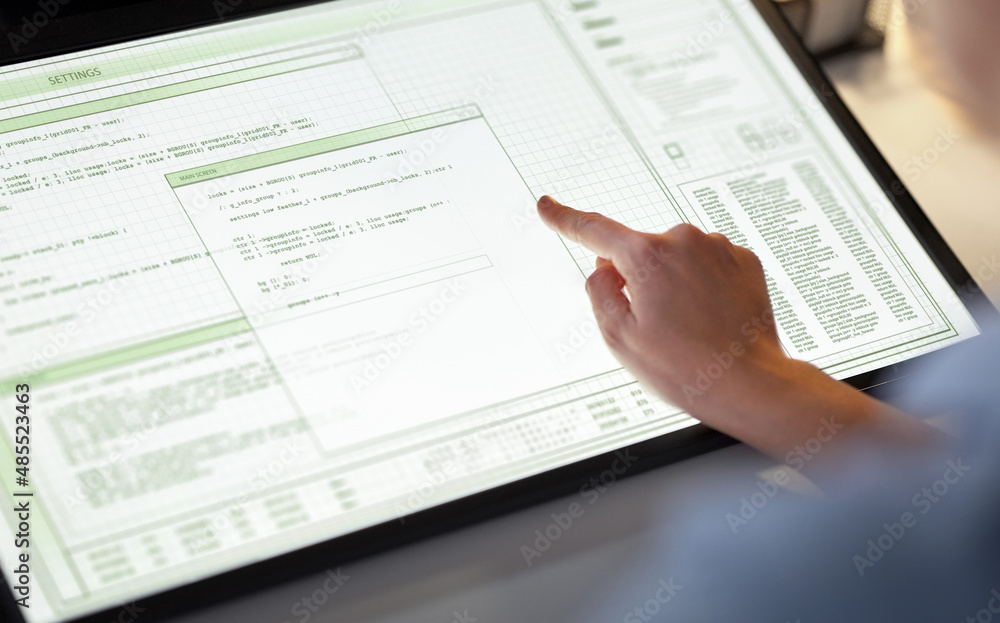 technology, programming and people concept - hand on led light tablet or touch screen with computer program at night office technology, programming and people concept - hand on led light tablet or touch screen with computer program at night office