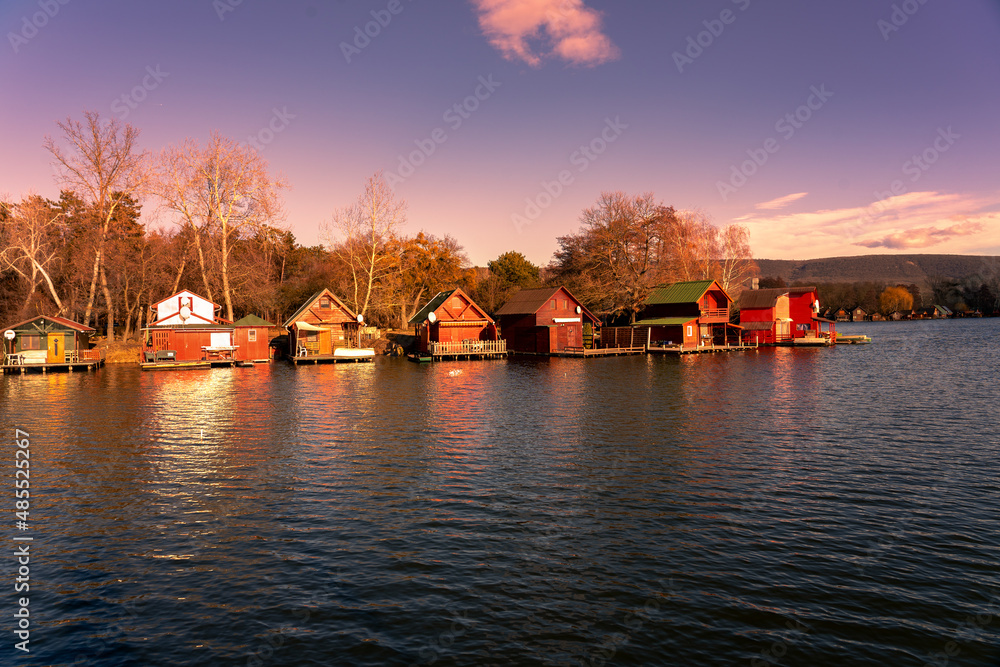 Derítő tó lake in Tata Hungary with cute colorful fishing cabins