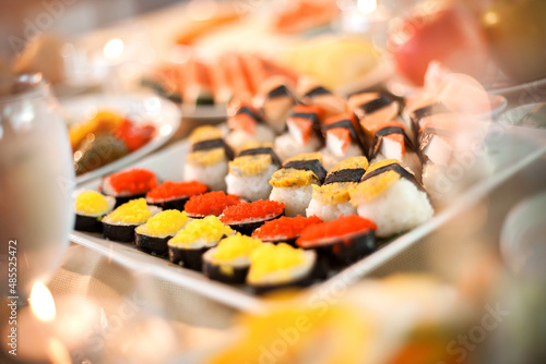 Close up Sushi Japaness main dish in wedding party ceremony event or hotel lounge restaurant or outdoor table. Dish of shrimps role, egg, crab stick. Catering food Cocktail celebration Decor ideas