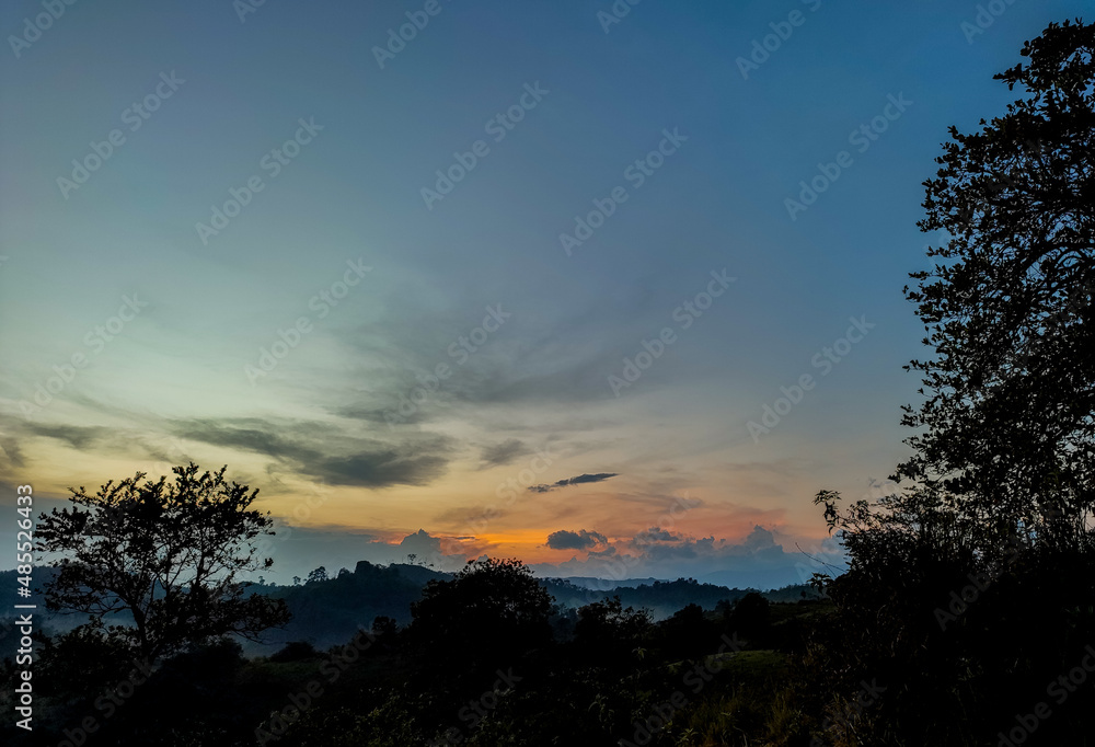 The sky of sunrise in the forest mountains of Borneo 