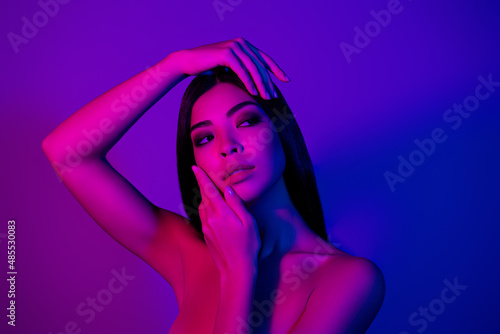 Photo of pretty lady touch hands face look empty space modern beauty procedure isolated vivid colorful background