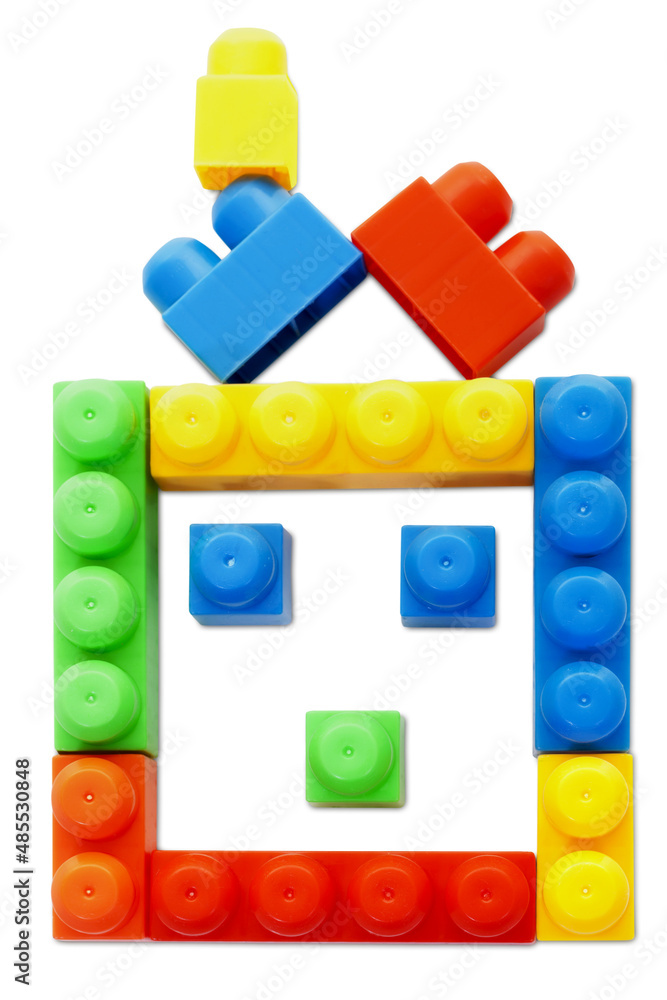 Plastic Bricks are Creating House Shape on Isolated White Background Plastic Bricks are Creating House Shape on Isolated White Background