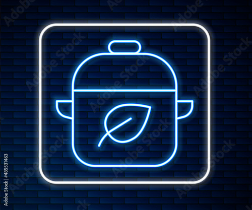 Glowing neon line Vegan food diet icon isolated on brick wall background. Organic, bio, eco symbol. Vegan, no meat, lactose free, healthy, fresh and nonviolent food. Vector