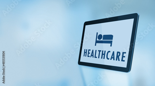 Patient Symbol and Healthcare Text On A Digital Tablet Screen