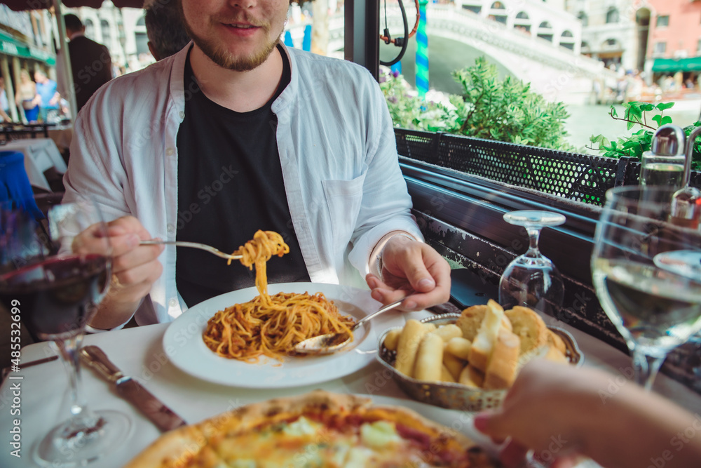 man sitting in cafe eating pasta drinking wine rialto bridge on background venice italy man sitting in cafe eating pasta drinking wine rialto bridge on background venice italy