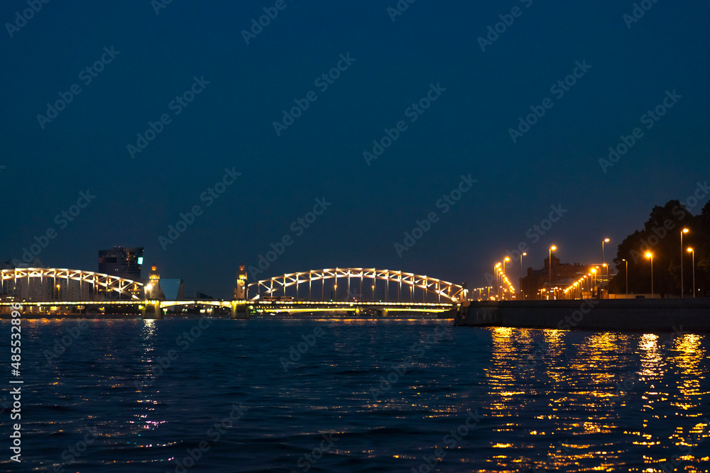 night view of illuminated Bolsheokhtinsky Bridge in Saint Petersburg, Russia