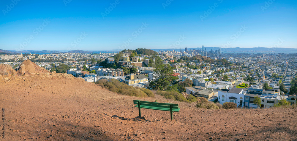 Bench on top of a hill with a view of the neighborhood in San Francisco bay area in California