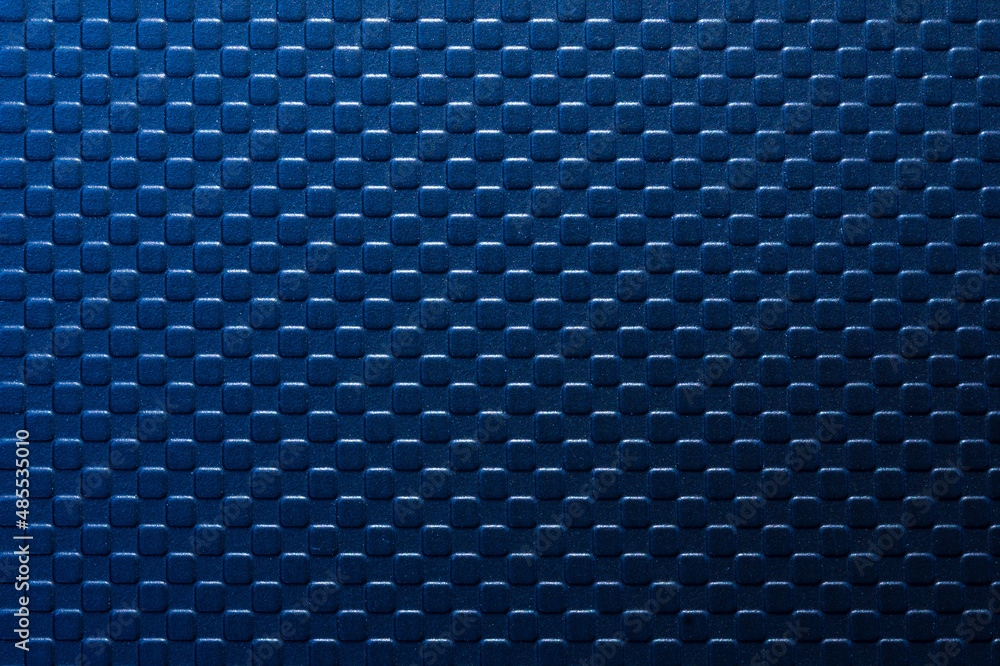 The blue square emboss texture background with lighting effect. The blue square emboss texture background with lighting effect.