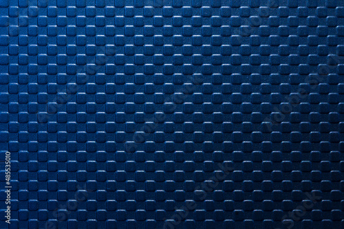 The blue square emboss texture background with lighting effect.