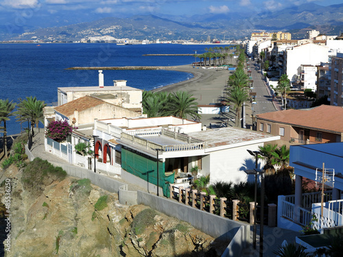 Street view from above straight down the beach front of Torrenueva Costa with Mediterranean sea and mountains. photo